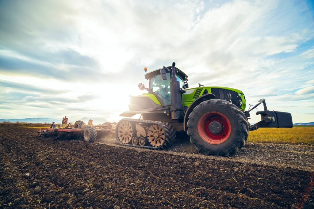 Modern tractor working on the farm, a modern agricultural transport