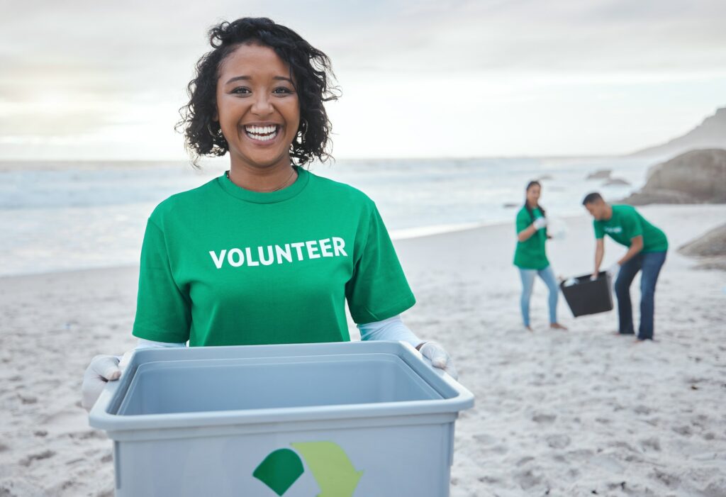 Recycle, smile and portrait of woman at beach for plastic, environment or earth day cleaning. Recyc